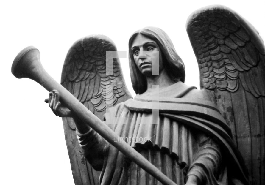 An image of a bronze angel statue holding a trumpet ready to sound a trumpet as mentioned in the book of Revelation. 
