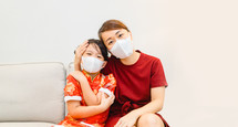 mother and child wearing face masks 