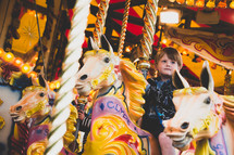 a boy on a carousel 