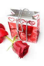 red rose and gift bag 