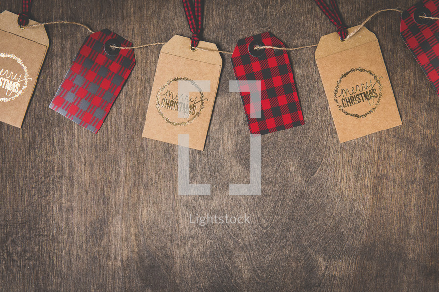 Merry Christmas and plaid gift tags on twine 