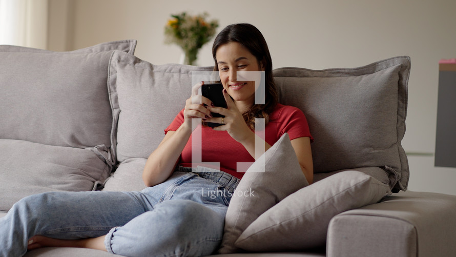 Woman using smartphone. Happy caucasian female enjoy online chat, internet purchase, browse web, download new cool freeware application. Modern wireless tech user concept 
