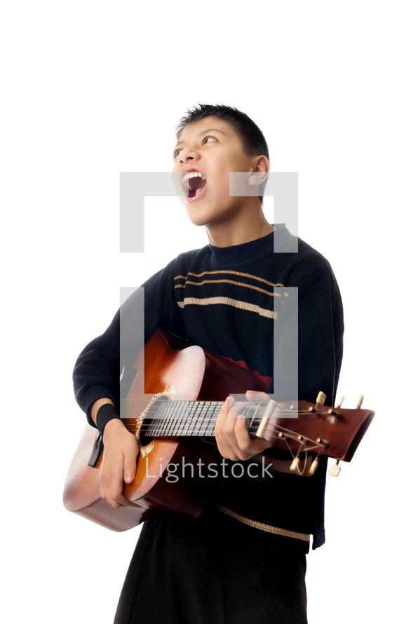 a boy playing a guitar 