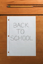 Back to School note and pencil on a desk