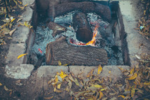 ashes and embers in a fire pit 