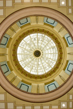 looking up at an ornate dome