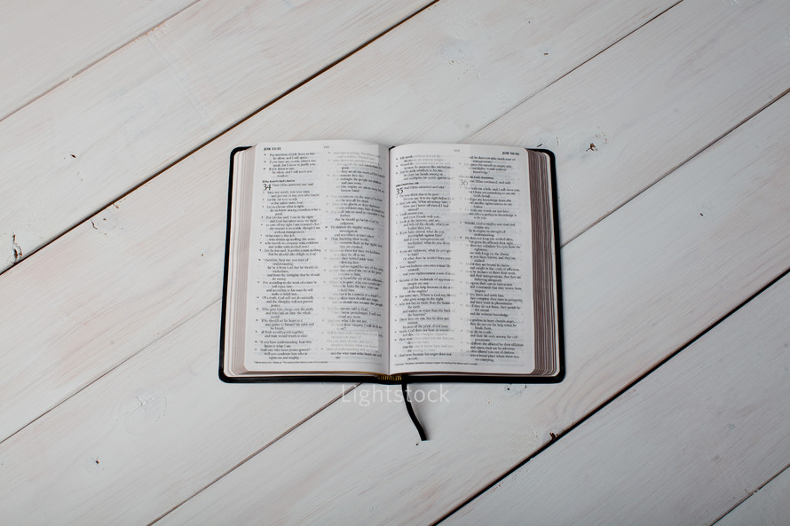 an open Bible on a table 