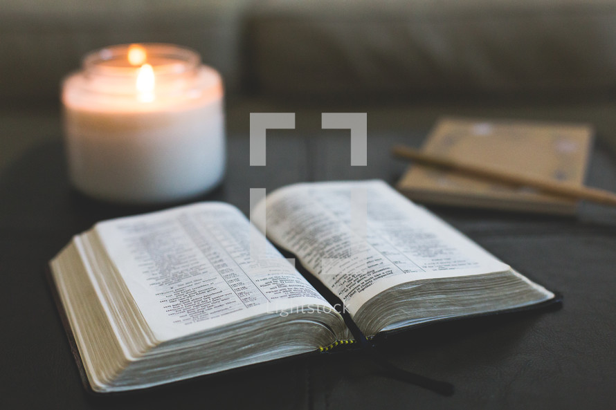 open Bible and candle 