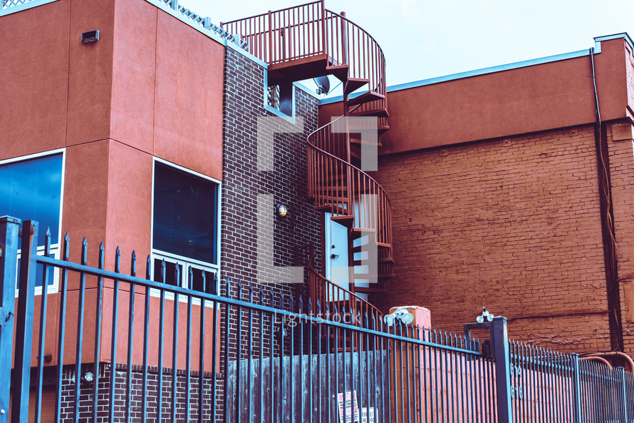 spiral staircase on the side of a building 