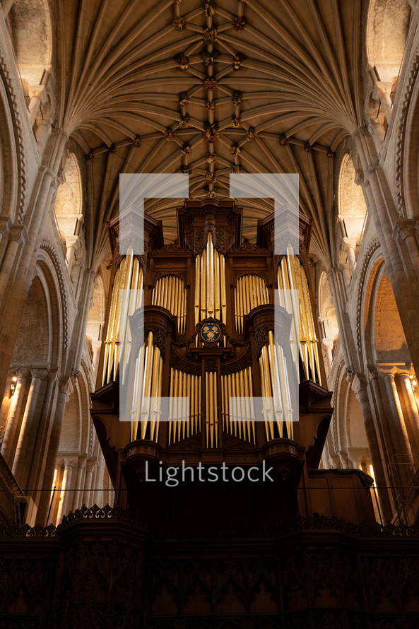 Church organ inside Norwich Cathedral, large pipe organ, beautiful religious architecture