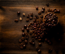 Coffee beans on a wooden tabletop
