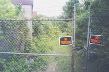 No trespassing sign on a gate 