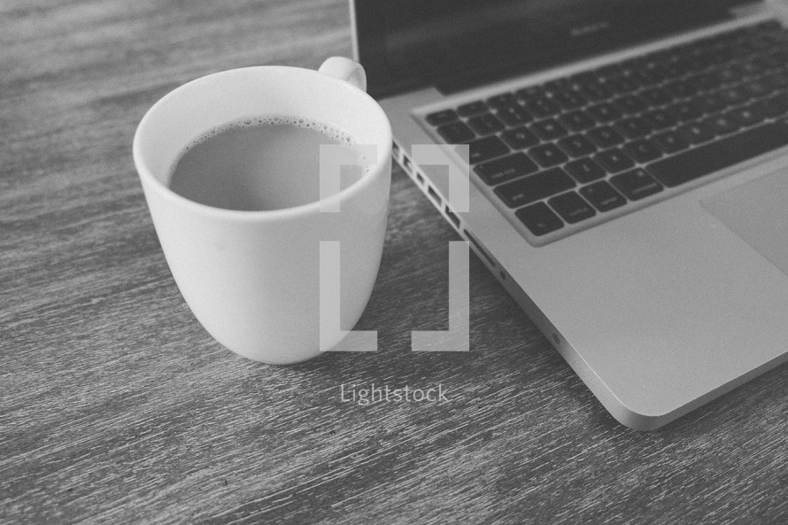 coffee in a mug and a laptop computer 