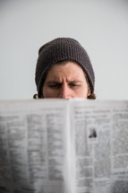 man reading a newspaper 