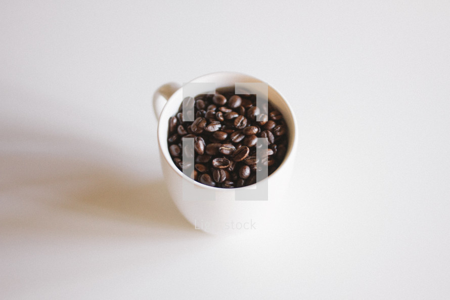 coffee beans in a coffee mug 