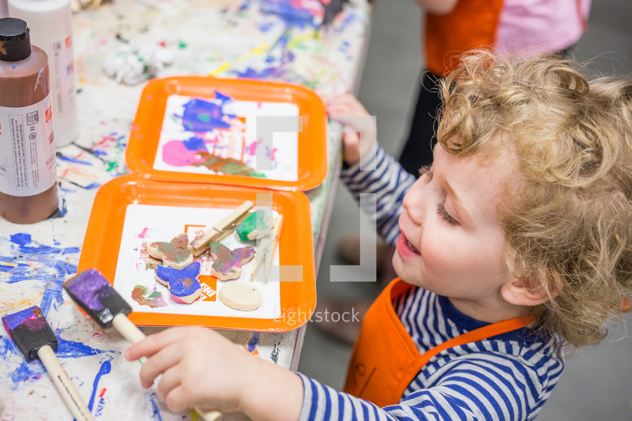 a child painting crafts 