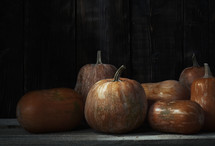 pumpkins and wood background 