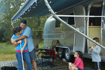 a family and a their camper 
