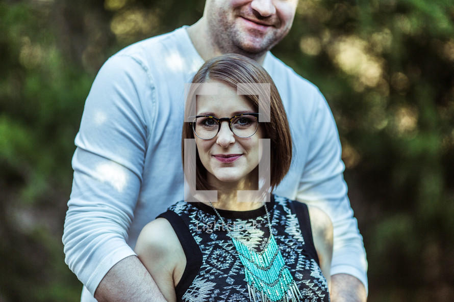 portrait of a couple with arms wrapped around each other