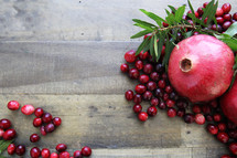cranberries, pomegranate, and green leaves 