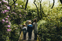kids on a path in a botanical gardens 