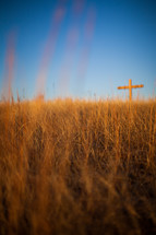 Cross on the hill at daybreak.