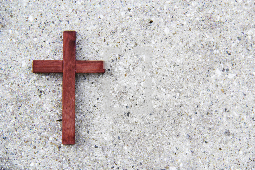 the wooden cross on concrete 