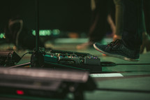 a man's foot on a guitar pedal 