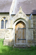 arched wooden door on a church 