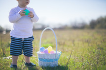 toddler boy and an Easter basket