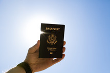 hand holding a passport