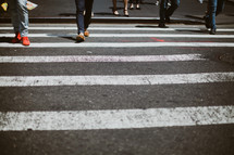 people crossing a crosswalk 
