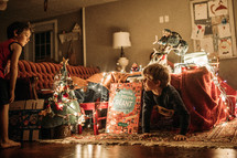 kids playing in blanket forts at Christmas 