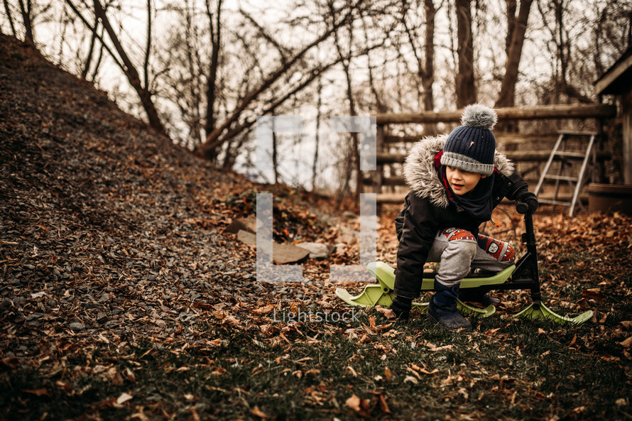 a child playing outdoors in fall 