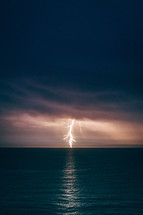 A bolt of lightning striking over the Atlantic Ocean