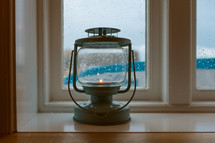 lantern in a window sil 