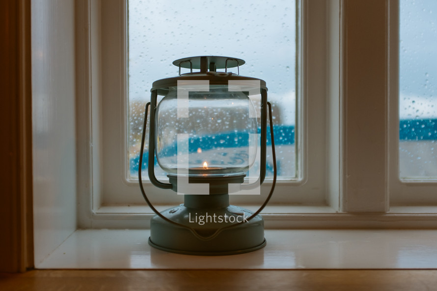 lantern in a window sil 