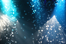 Bubbles cascading in blue spotlights 