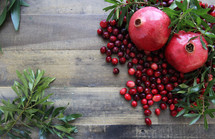 green leaves, pomegranate and cranberries 