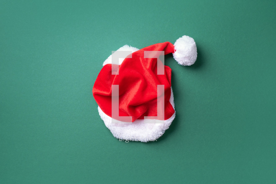 Red Santa Clause hat and wreath with copy space