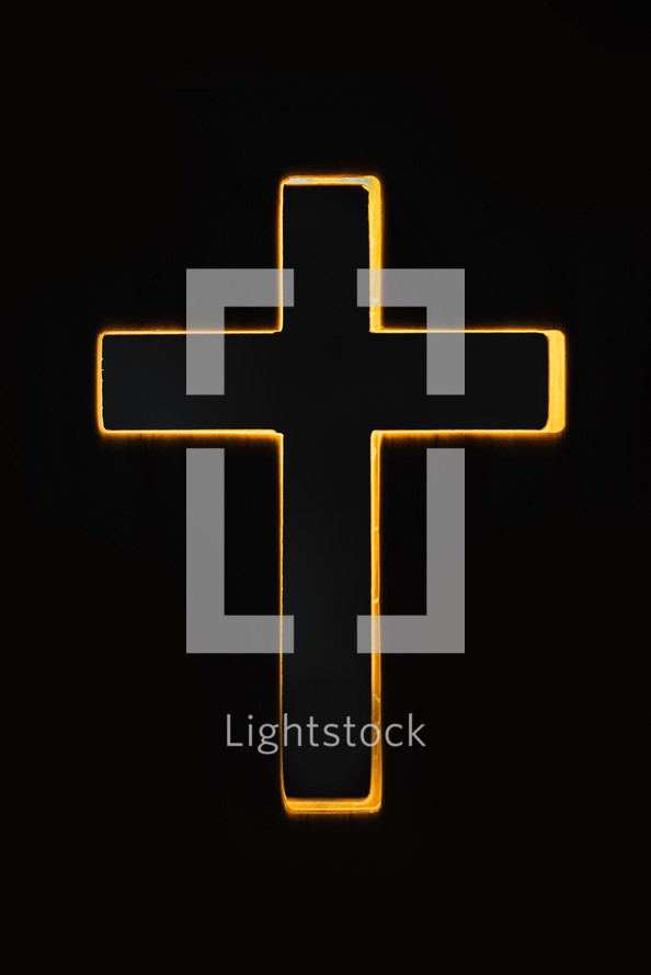Silhouette of christian cross on black background. Copy space. 