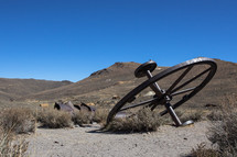 old wagon wheel in a desert 