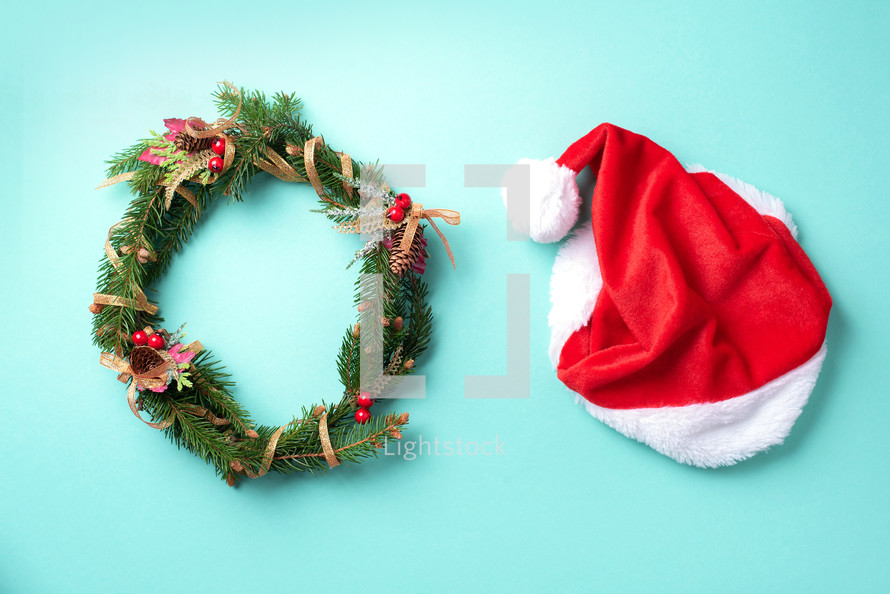 Red Santa Clause hat and wreath with copy space