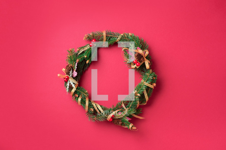 Christmas wreath on a red background