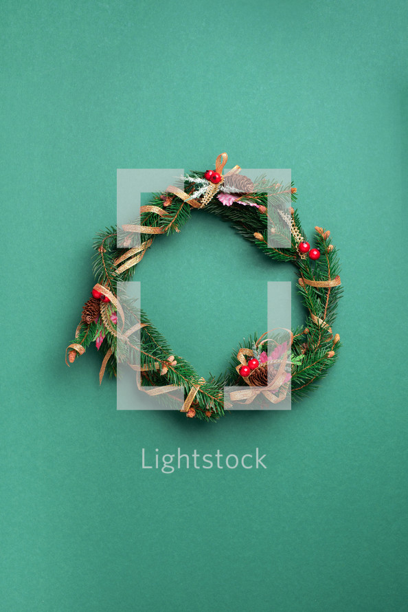 Christmas wreath on a green background