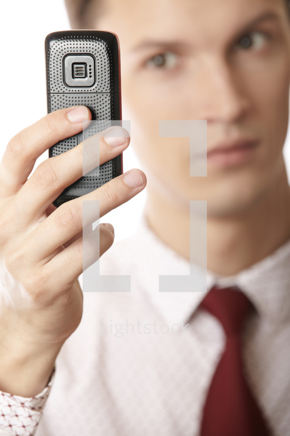 businessman holding a voice recorder 