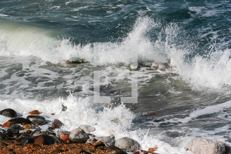 Waves crashing onto the shore of the Dead Sea