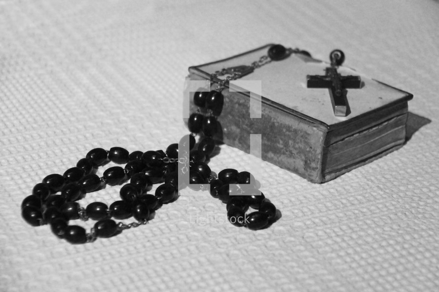 rosary on an old Bible 