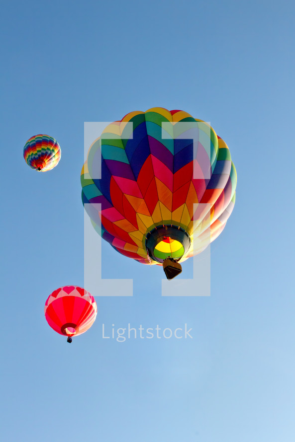 Colorful hot air balloons flying at the Colorado Balloon Classic.
