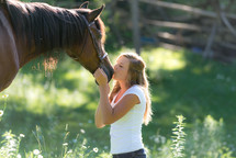 woman kissing a horse 